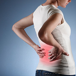 Patient with a growing lower back problem requires assistance